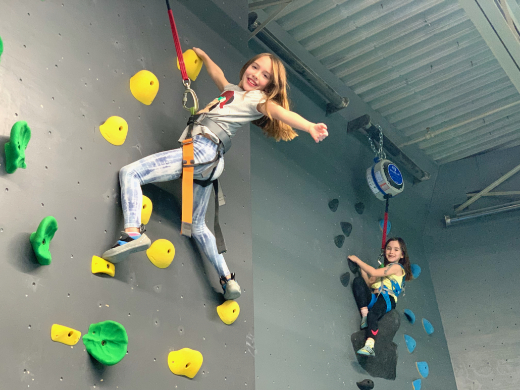 Climber on wall smiling